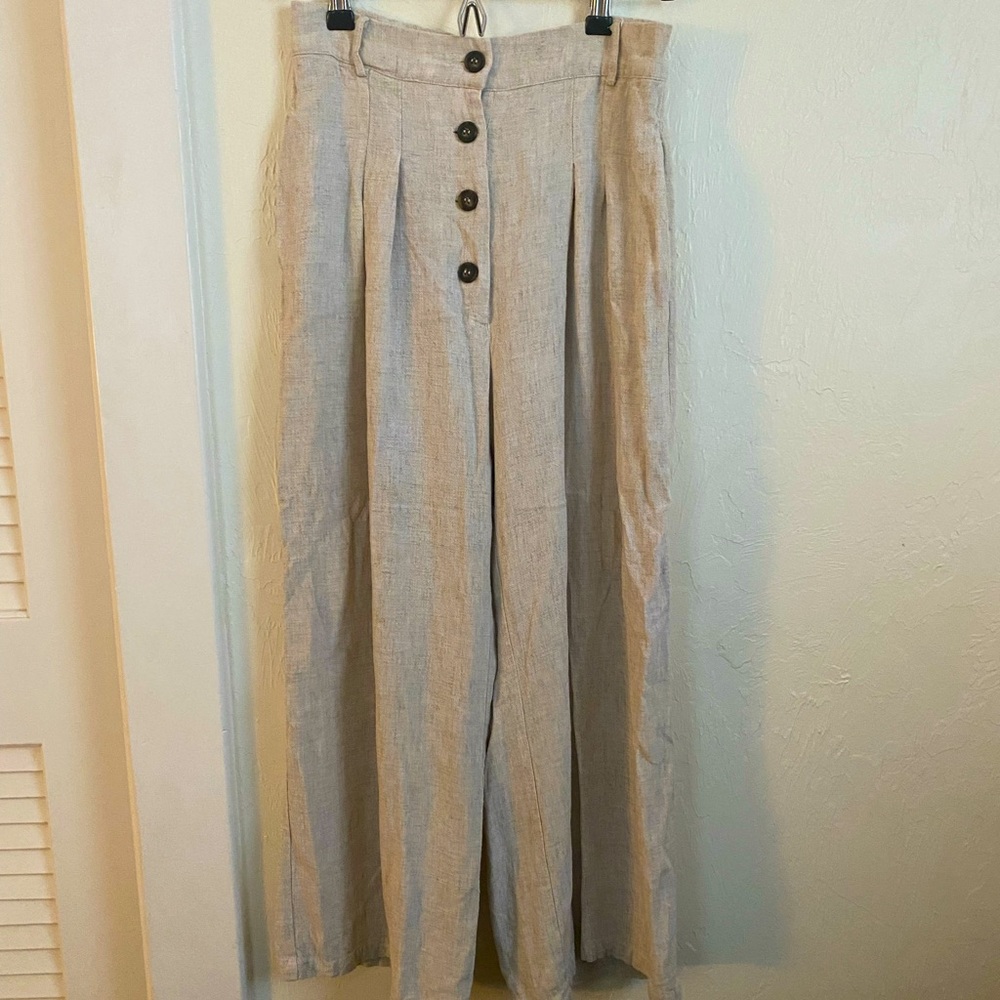 Shop Eye to Eye beige wide leg linen trousers. Exposed buttons, size small.